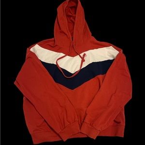 Ambiance brown hoodie with a white and navy blue stripe in the front.